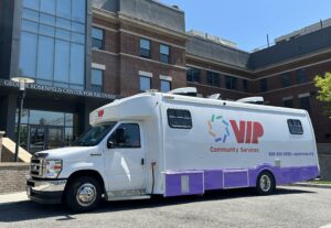 Mobile medication unit delivering treatment services to community members in underserved neighborhoods
