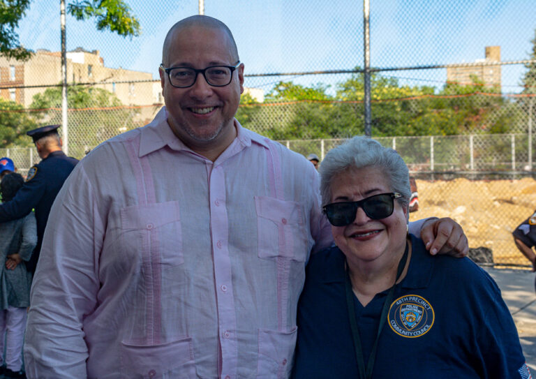 People pose at health fair outside VIP Community Services building in the Bronx