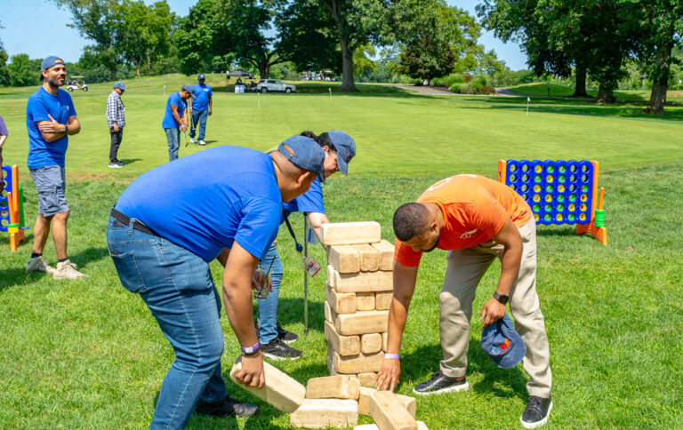 Staff plays Jenga for Staff Appreciation Day at VIP Community Services