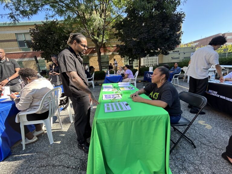 Attendee receives information from participant table at VIP's 2026 Job Fair.