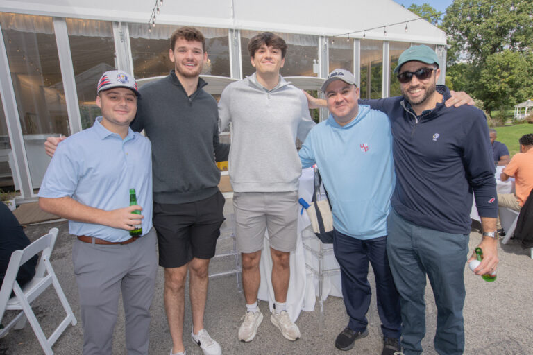 Attendees of Inaugural Golf Outing pose for photo.