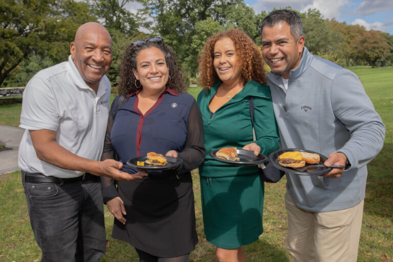 New York State Senator Nathalia Fernandez poses for photo with attendees.