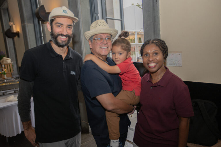 Debbian Fletcher-Blake President and CEO poses for photo with attendees of Inaugural Golf Outing.