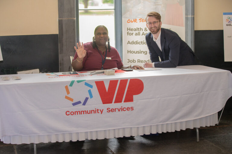 Mike Esposito, CFRE, founder and lead fundraising strategist of Mike Esposito Fundraising poses for photo at VIP table with a VIP team member volunteer.