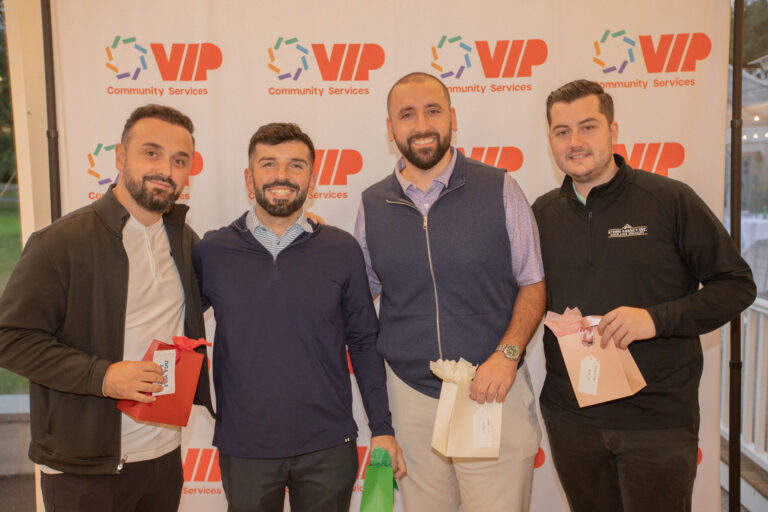 Winners of golf competition pose for photo.