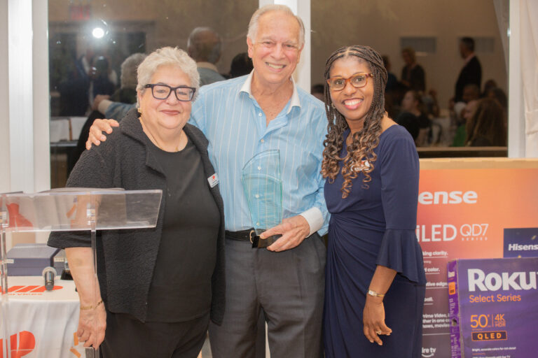 Carmen Rivera SVP / Chief Vocational & Community Affairs Officer, Honoree Nick Lugo, President & CEO of the New York City Hispanic Chamber of Commerce, and Debbian Fletcher-Blake President and CEO, pose for photo with Nick holding his award.