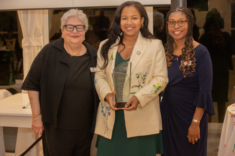 Carmen Rivera SVP / Chief Vocational & Community Affairs Officer, honoree New York State Assemblymember Amanda Septimo , and President and CEO Debbian Fletcher-Blake, pose for a photo with Amanda holding up award.