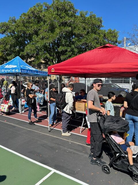 Crowd of attendees at the Fruit & Vegetable Distribution event.