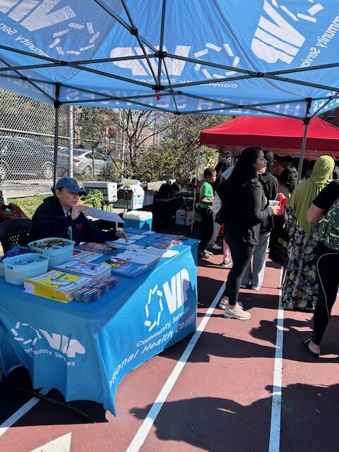 VIP Community Services' Health Services table and tent at the Fruit & Vegetable Distribution.